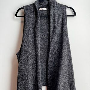 2 black sweater vests